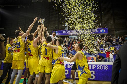 Kosovo hold the champions' trophy aloft
