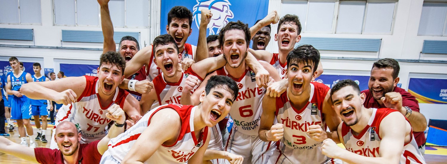 Players of Turkey celebrate after winning the semifinal game against Slovenia
